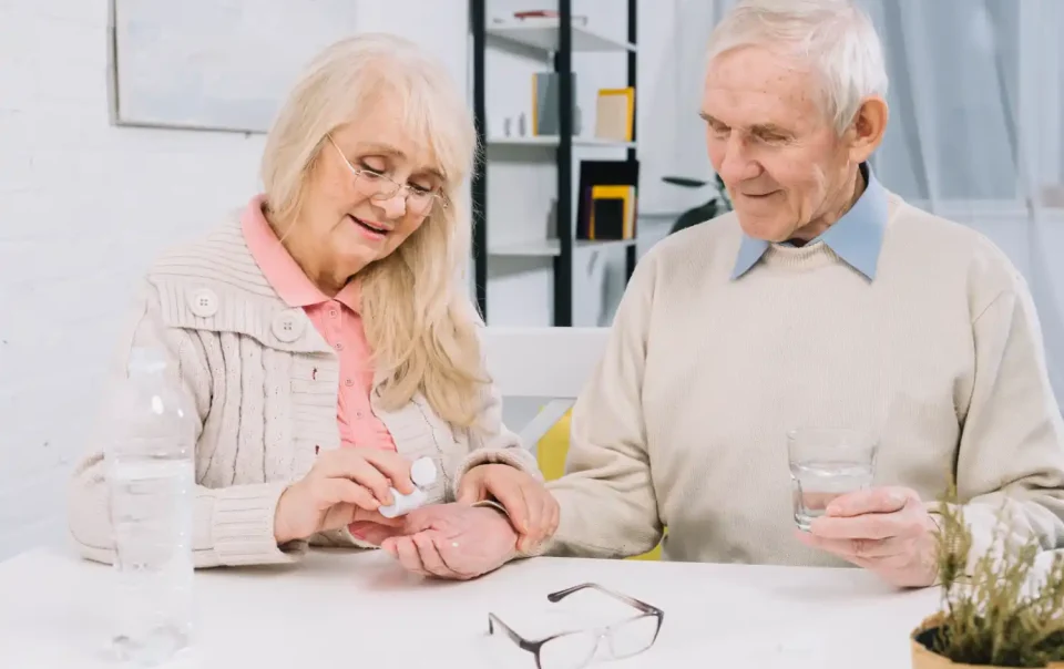 Senior couple taking brain health supplements like Astaxanthin for memory support and cognitive clarity - Save your Brain Health