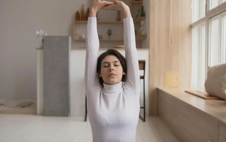 A Young Girl practicing deep breathing to reduce stress using a science-backed technique - Save your Brain Wellness