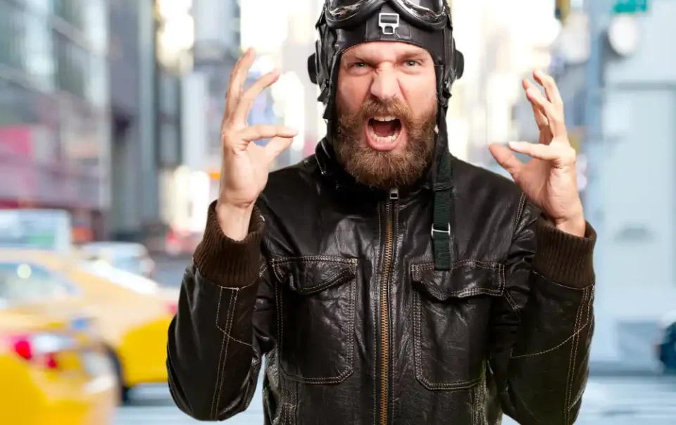 Bearded man showing intense fear or anger reaction in urban environment, representing subconscious emotional response I Save your Brain wellness